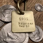 1981 De Lorean Dmc -12 Brass Key Fob 1982, 1983, New. Price: $15.95.